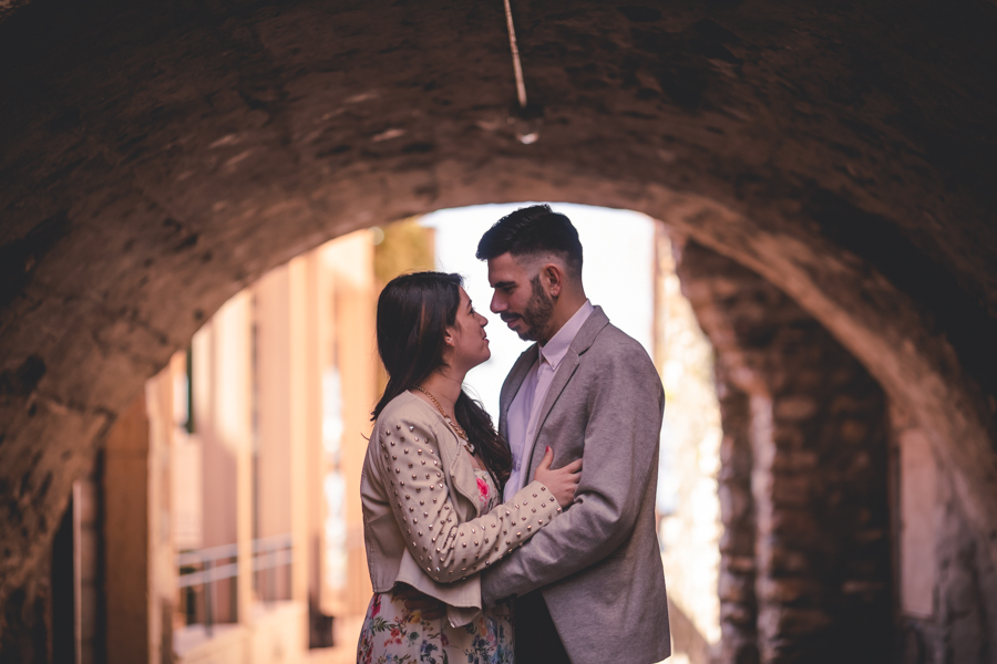 Couple of lovers in the narrow streets of Torri Del Benaco, Lake Garda